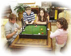 Children playing Skittle Pool game